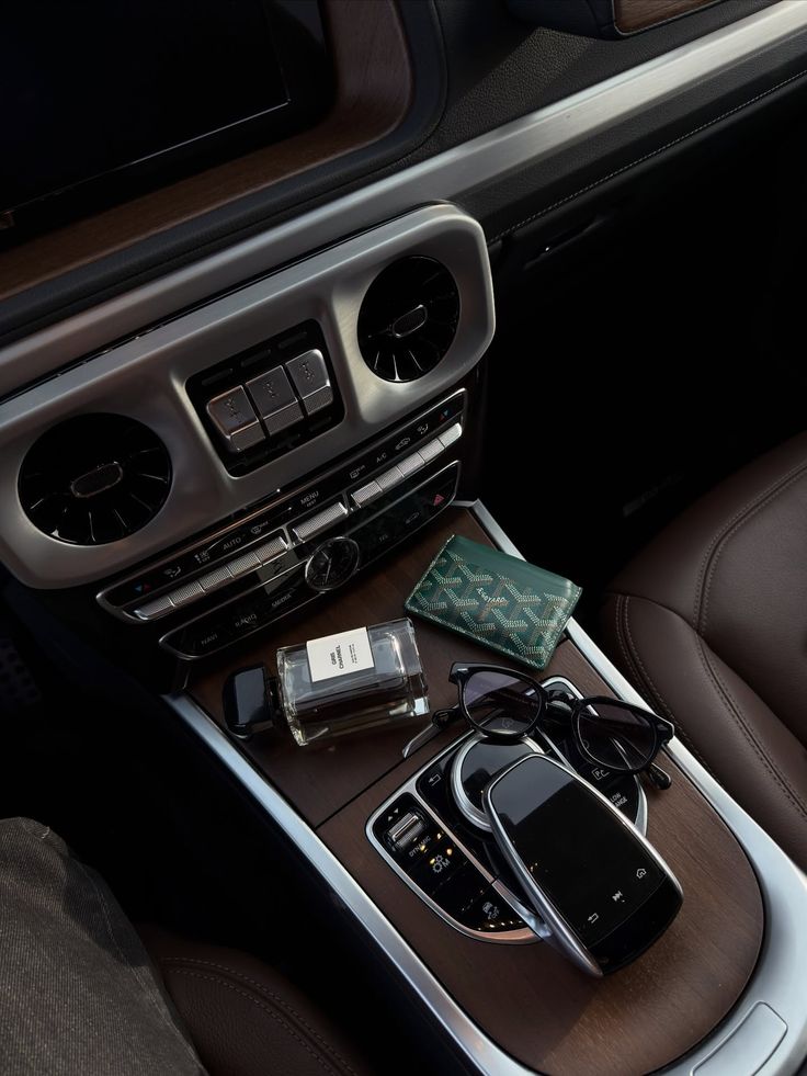 Car console with phone, glasses, cardholder, and daily car kit items