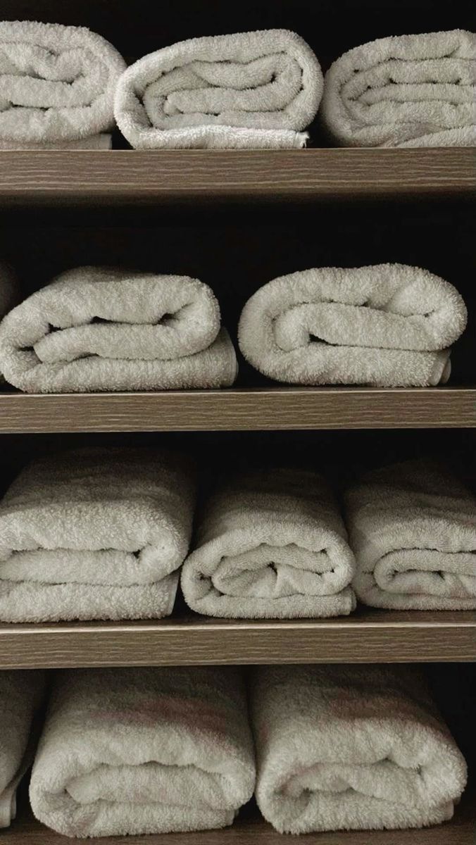 Folded clean microfiber towels on shelves