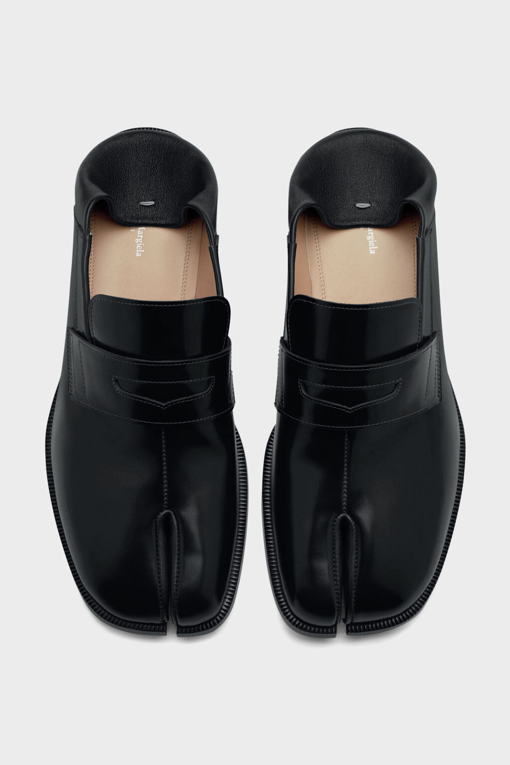 Black Maison Margiela Tabi loafers on a light background
