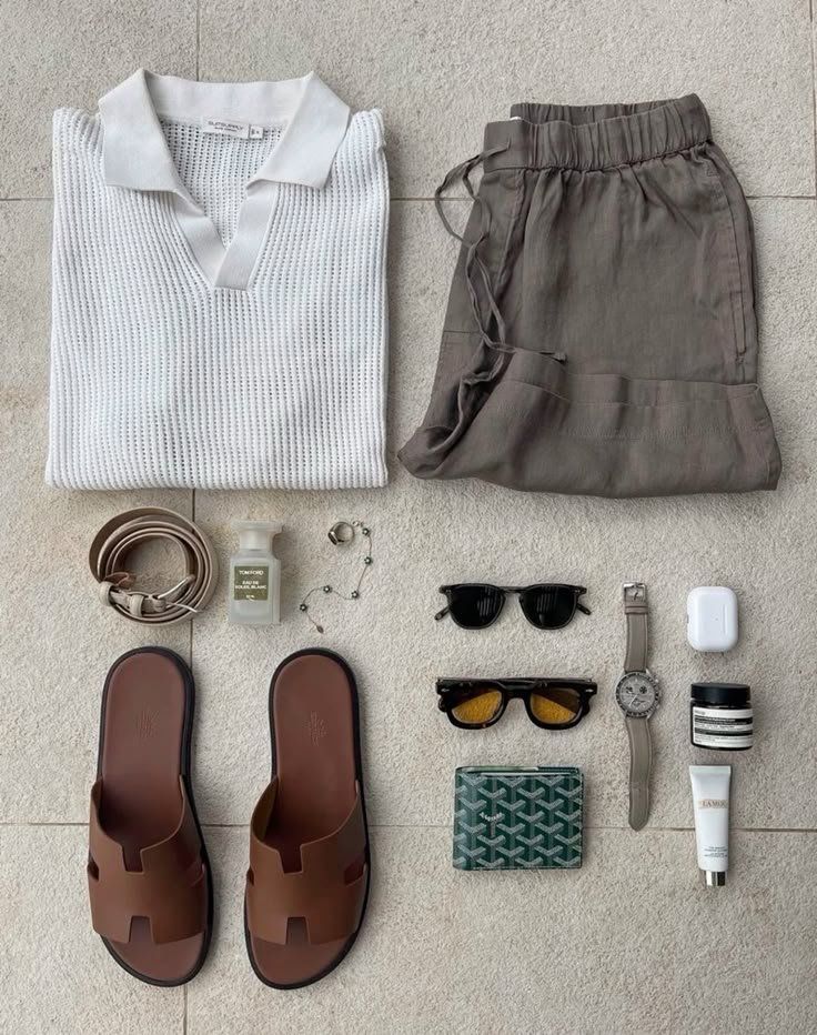 Neutral summer outfit layout with shirt, trousers, sandals, sunglasses, watch, and grooming pieces
