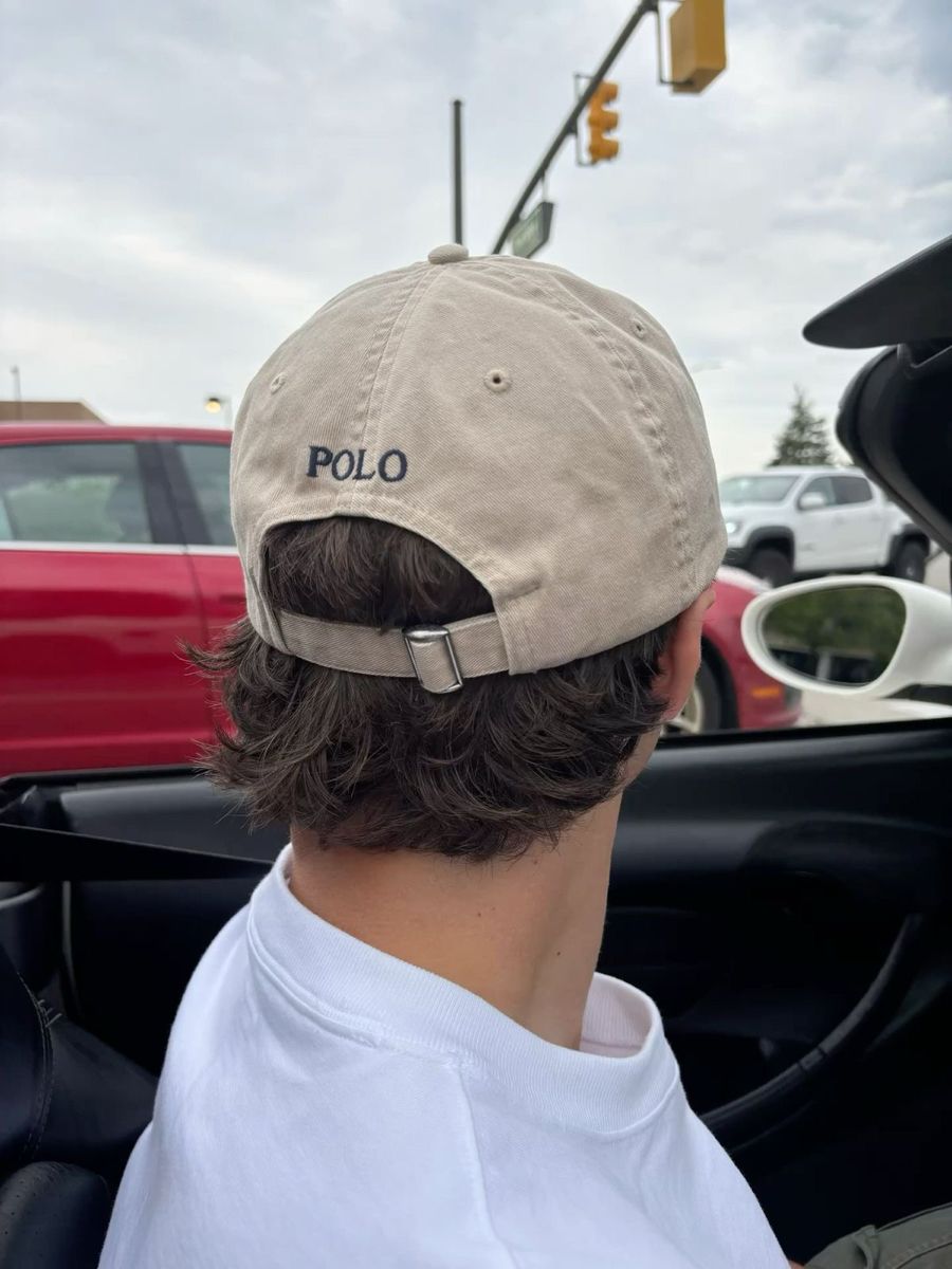 Neutral Polo cap worn in a car