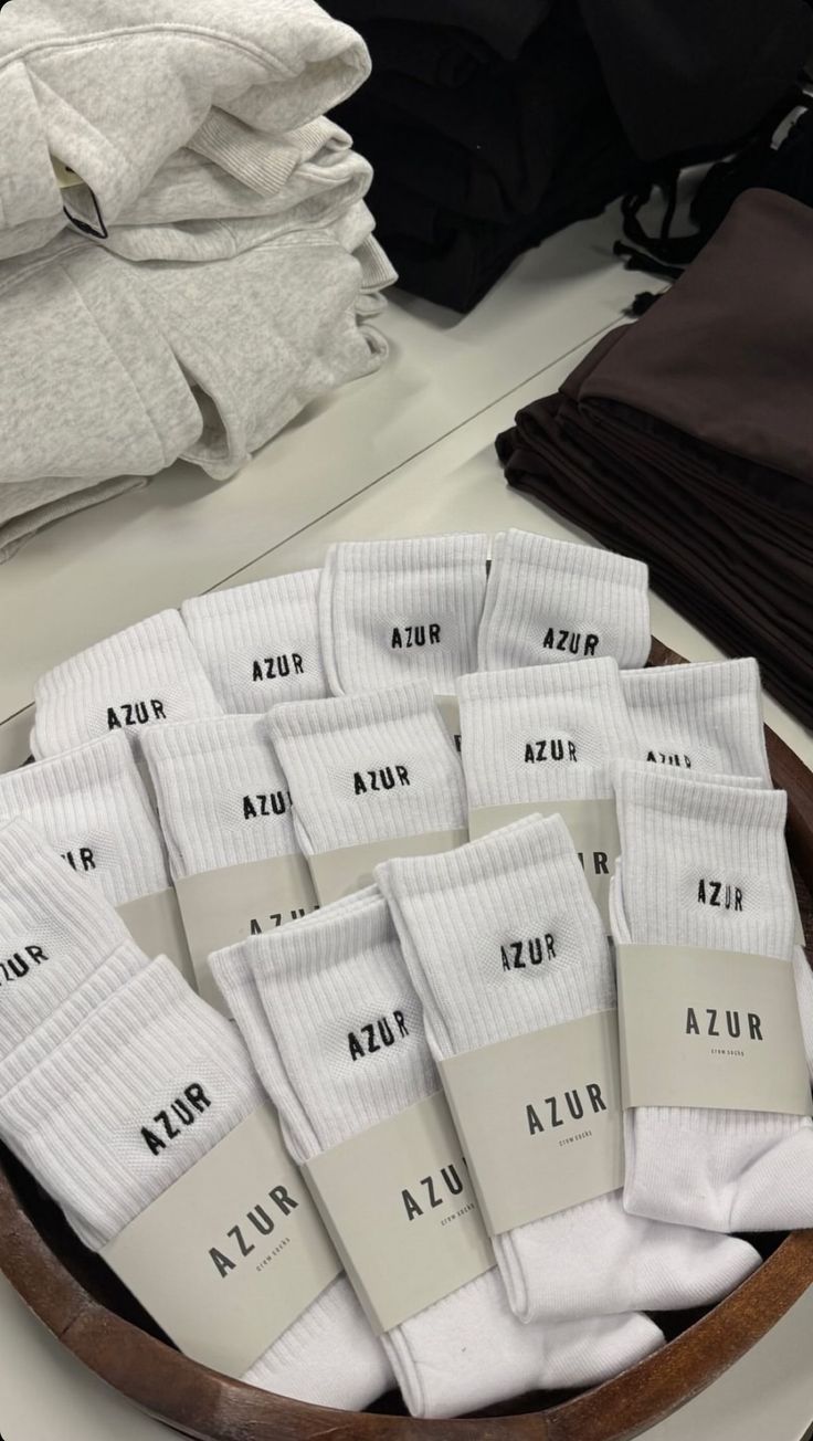 Fresh white socks arranged in a store basket